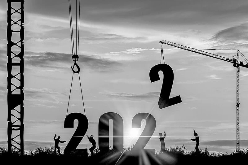 The numbers 2022 being lowered to the ground by cranes for facility management